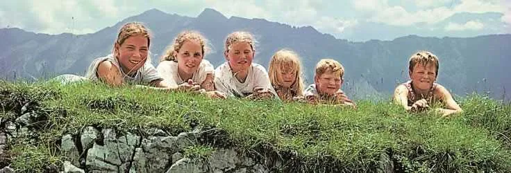 Swiss family in a traditional alpine landscape