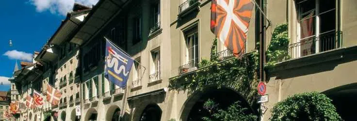 Swiss town street decorated with flags and flowers